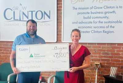 image of GROW Clinton presenting a donation to JA of the Heartland
